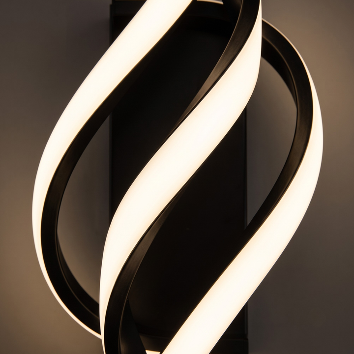 Close-up of sculptural twisted LED light bars with warm white glow