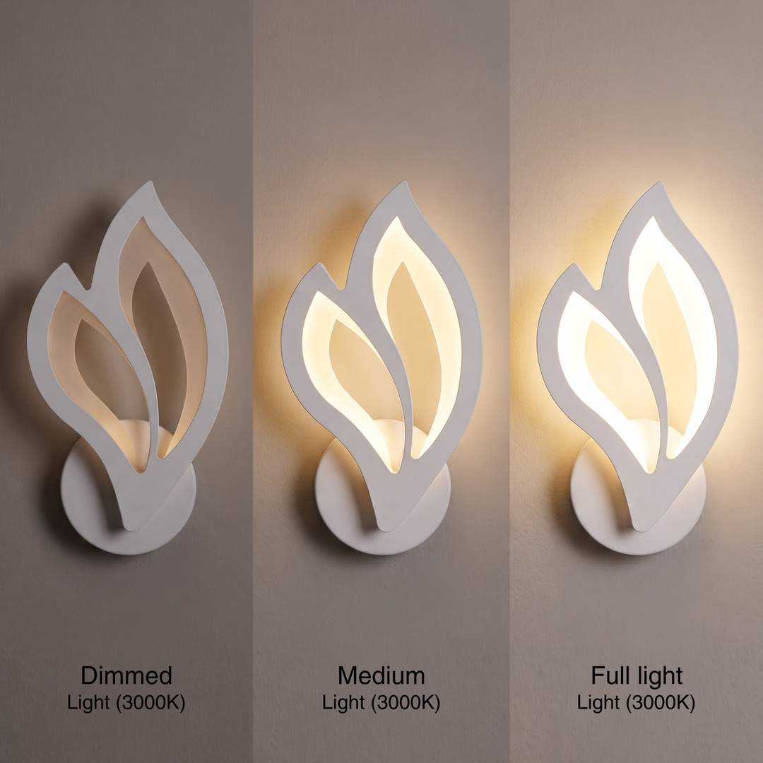 White leaf wall sconce glowing warm white, dimmable LED bedside lamp