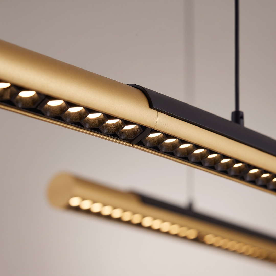 75 inch staggered linear pendant light above kitchen island with warm light