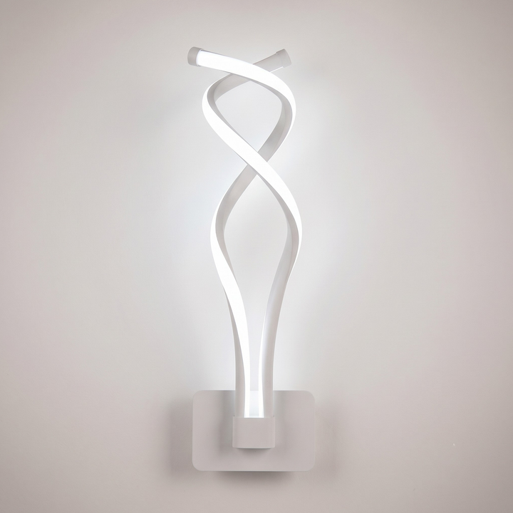 White spiral LED wall sconce glowing cool white on off-white wall
