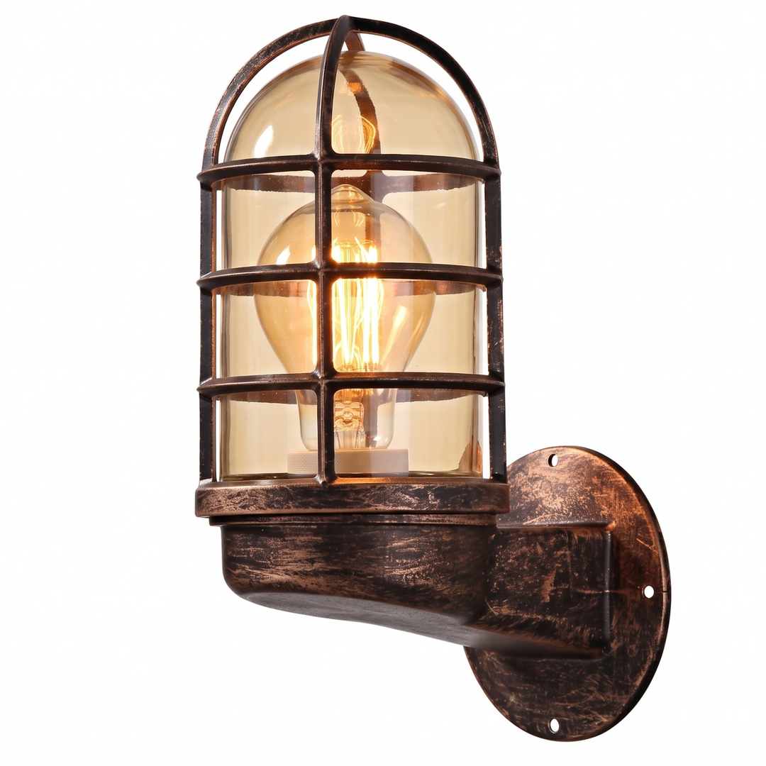 Antique bronze industrial cage wall sconce with glass dome and glowing Edison bulb