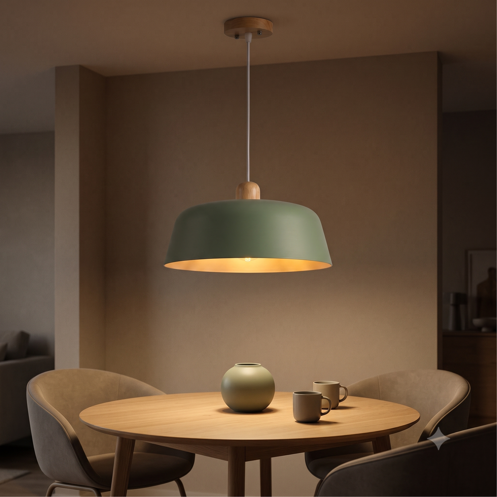 Sage green pendant lamp hanging above round oak dining table in modern dining room